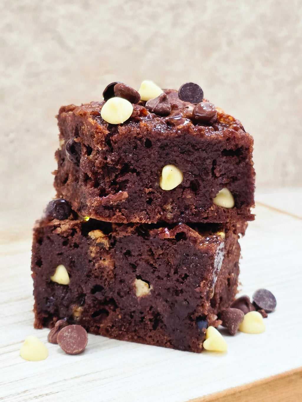 Triple Chocolate Brownies made from the Lady Baker Triple Chocolate Brownie Mix, stacked to show fudgy texture and chocolate chunks