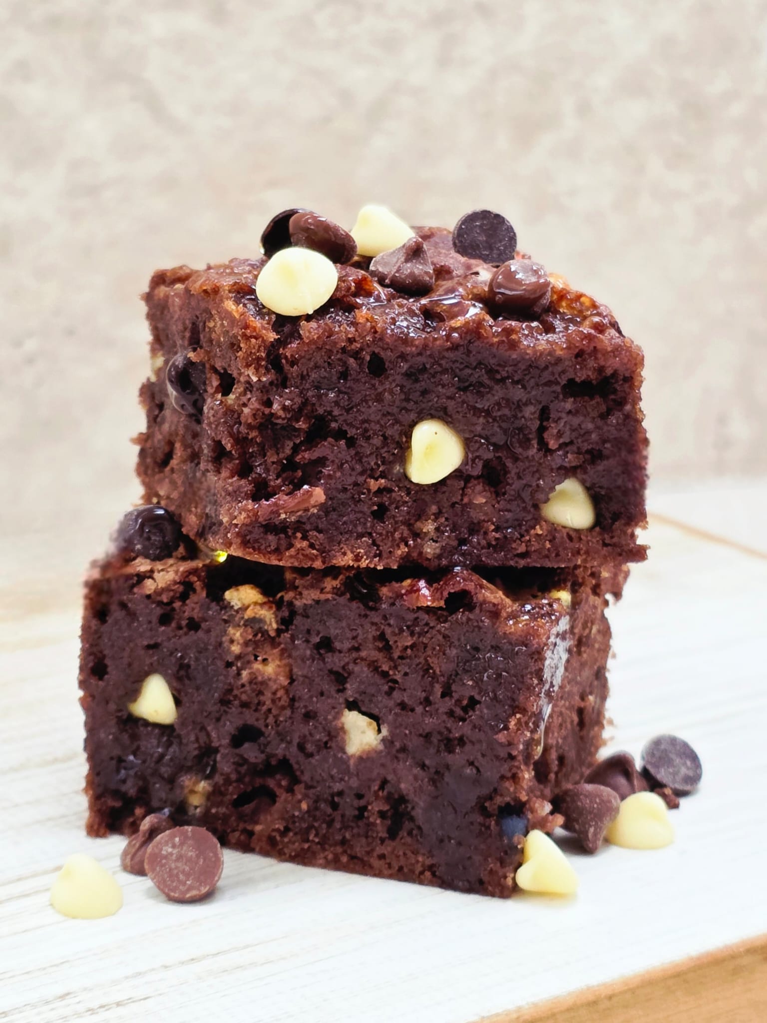 Triple Chocolate Brownies made from the Lady Baker Triple Chocolate Brownie Mix, stacked to show fudgy texture and chocolate chunks