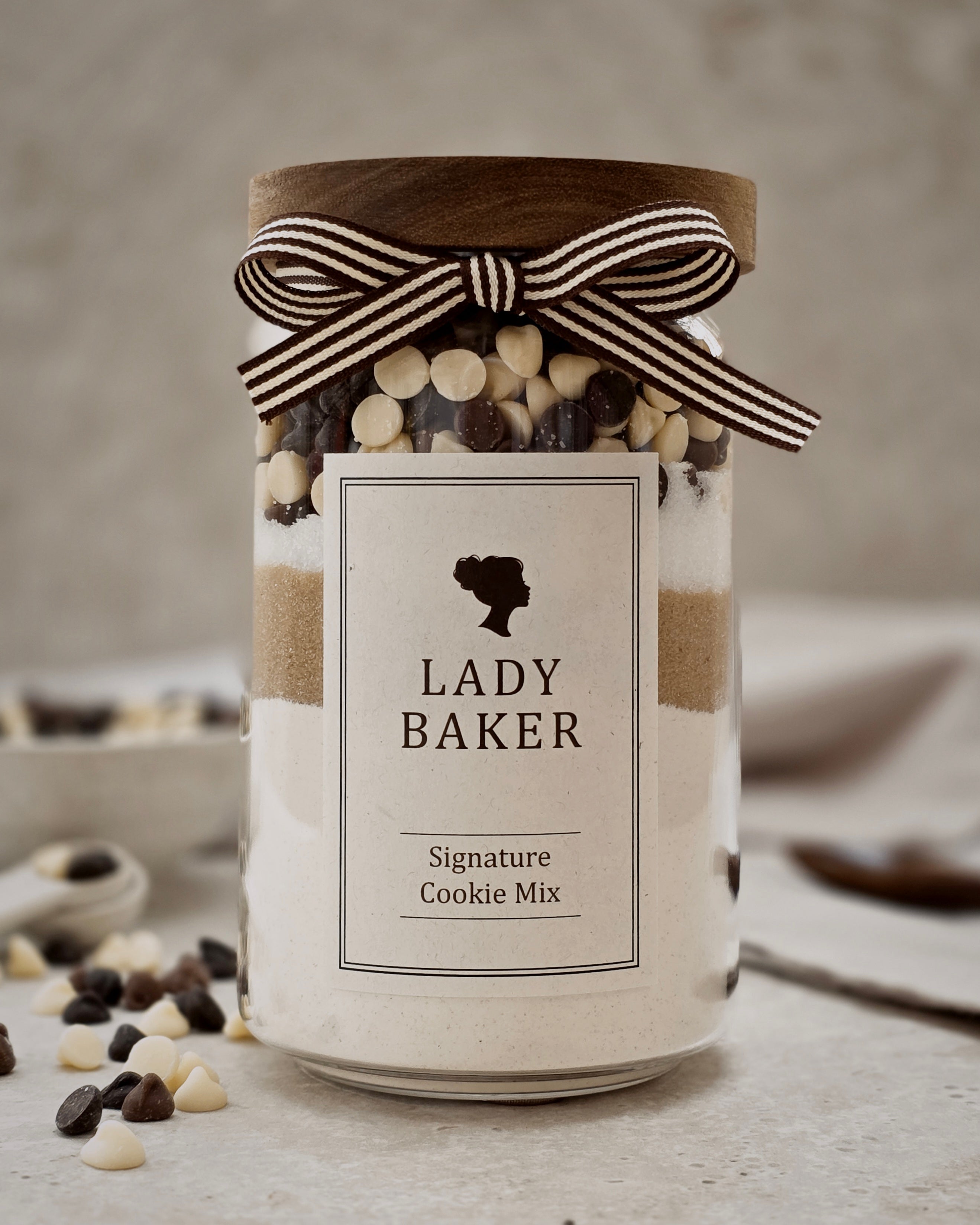 Lady Baker Signature Cookie Mix in glass jar with ribbon